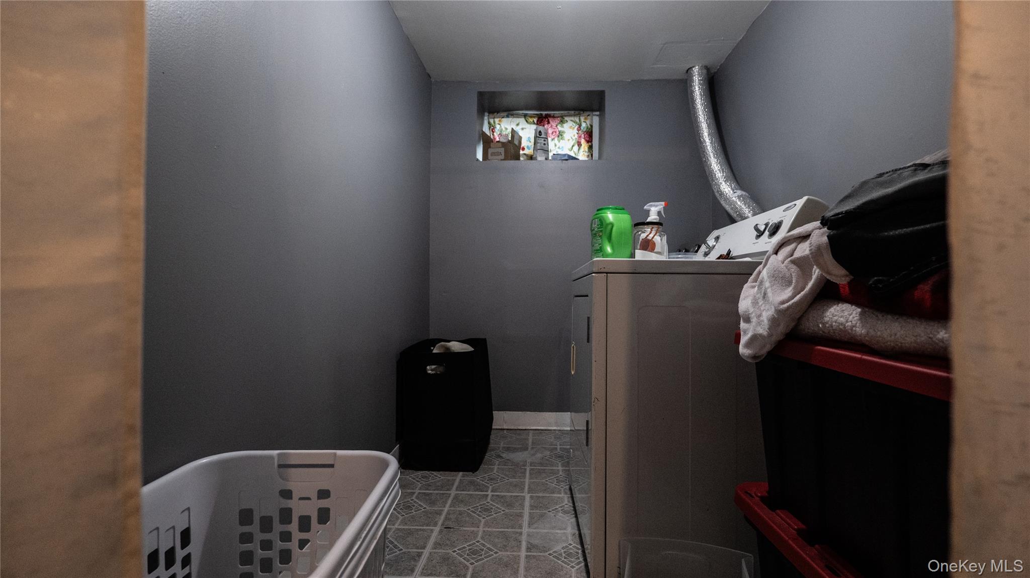 52 Beacon Street Newburgh, NY 12550 - Photo 10 of 12 Laundry room with independent washer and dryer and light tile patterned floors