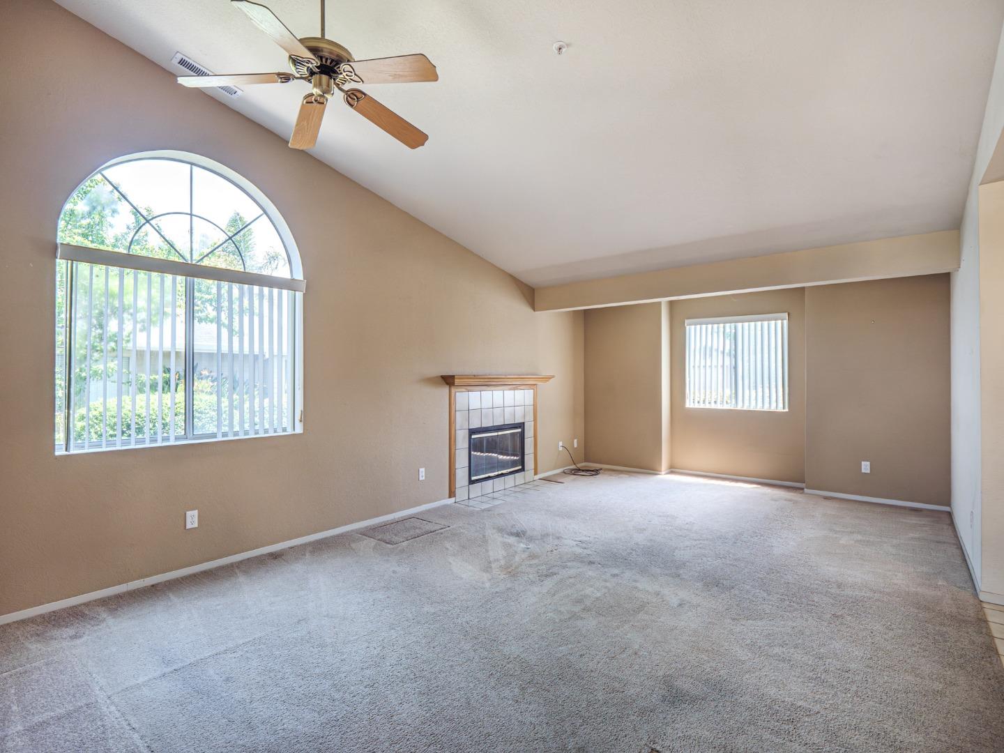 313 Sombra Watsonville, CA 95076 - Photo 15 of 37 an empty room with windows and fan