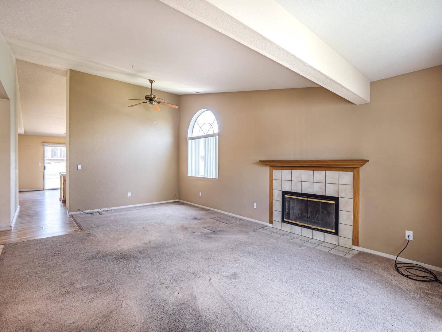 313 Sombra Watsonville, CA 95076 - Photo 18 of 37 an empty room with windows and fireplace