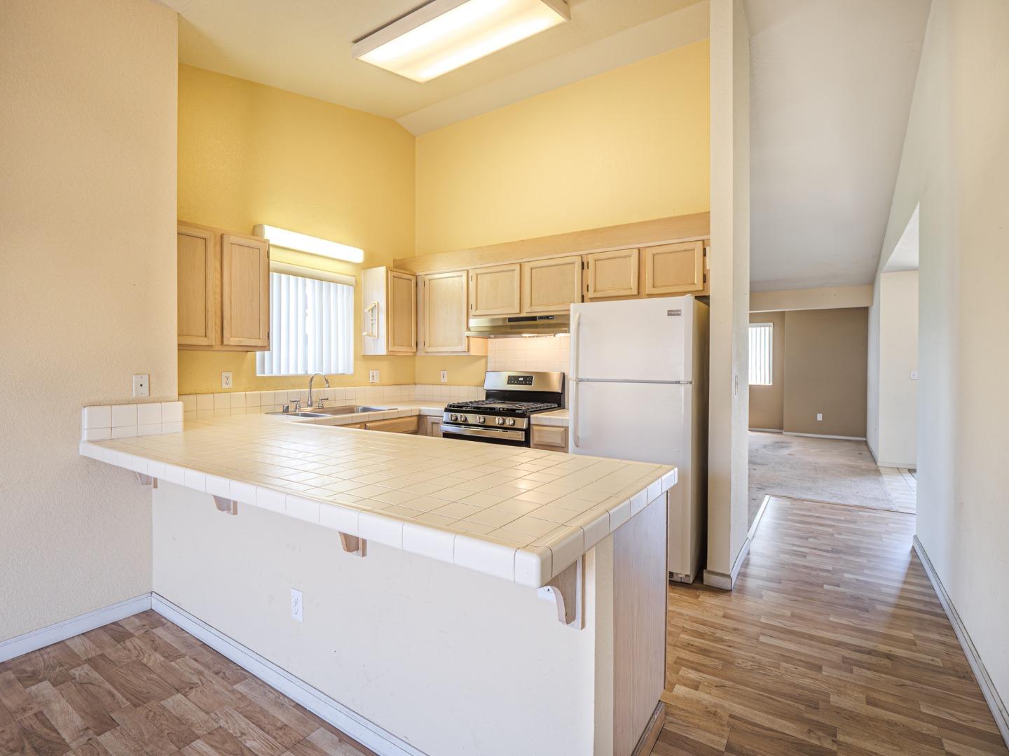 313 Sombra Watsonville, CA 95076 - Photo 24 of 37 a kitchen with a refrigerator a sink and a stove