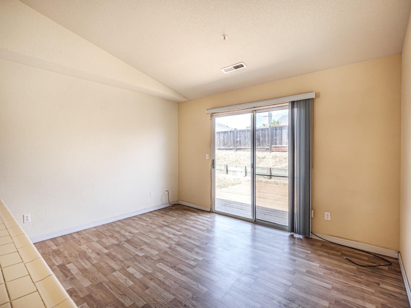 313 Sombra Watsonville, CA 95076 - Photo 28 of 37 an empty room with wooden floor and windows