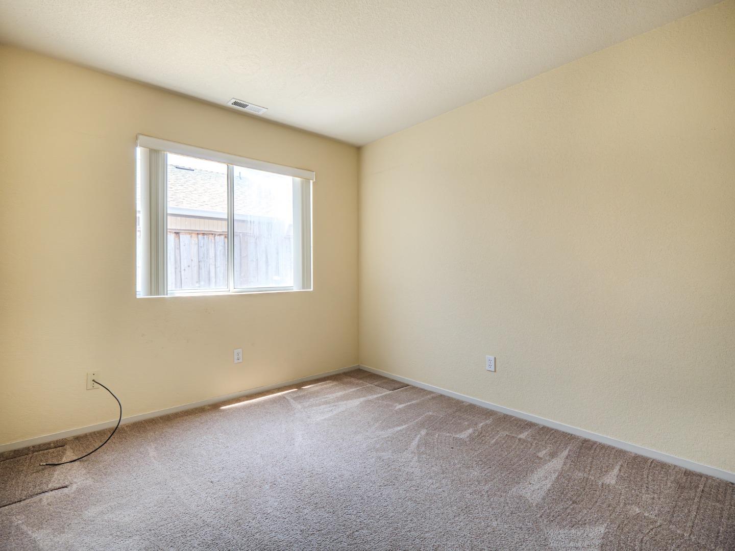 313 Sombra Watsonville, CA 95076 - Photo 35 of 37 an empty room with a window