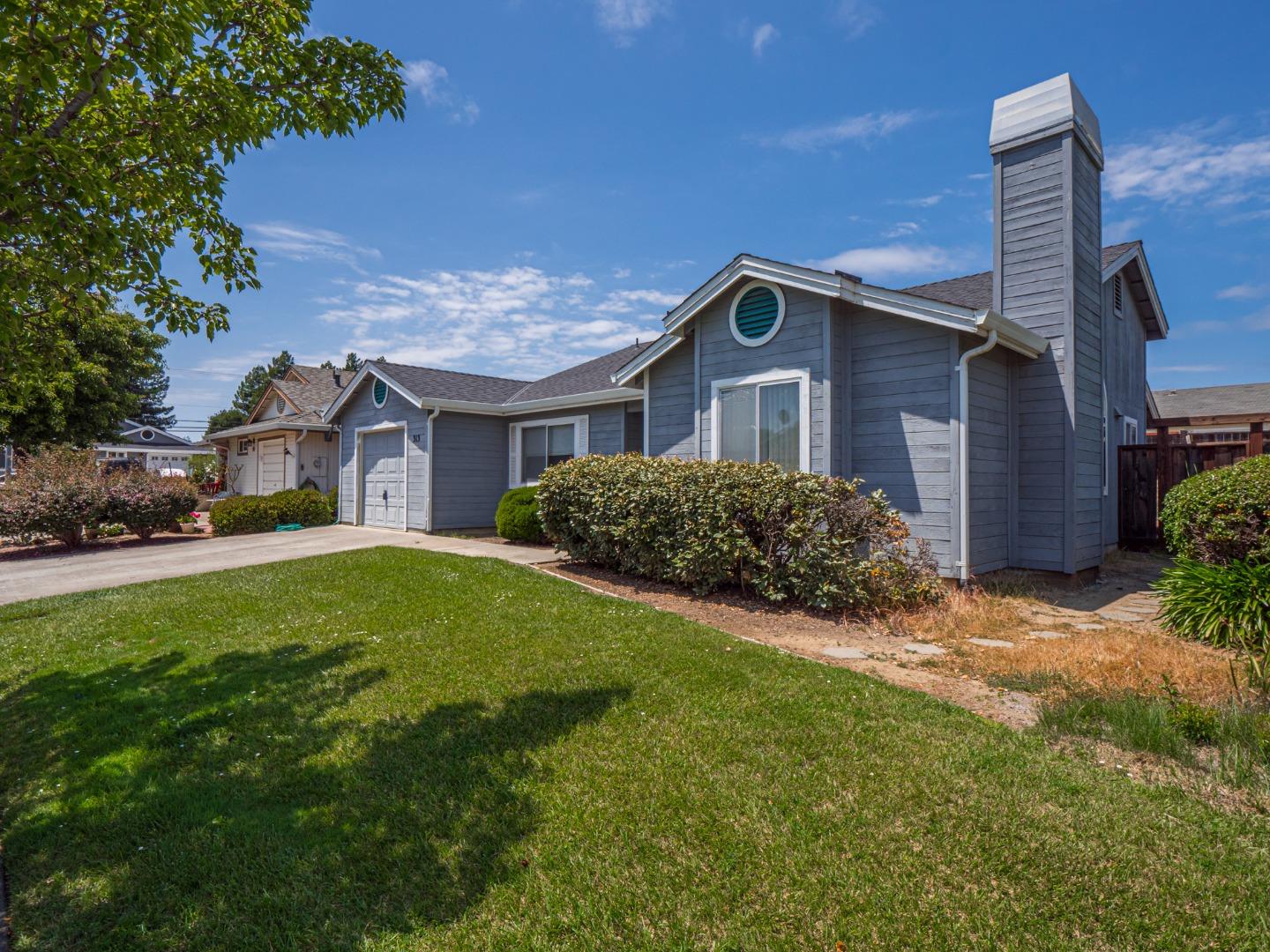 313 Sombra Watsonville, CA 95076 - Photo 4 of 37 a house view with a garden space