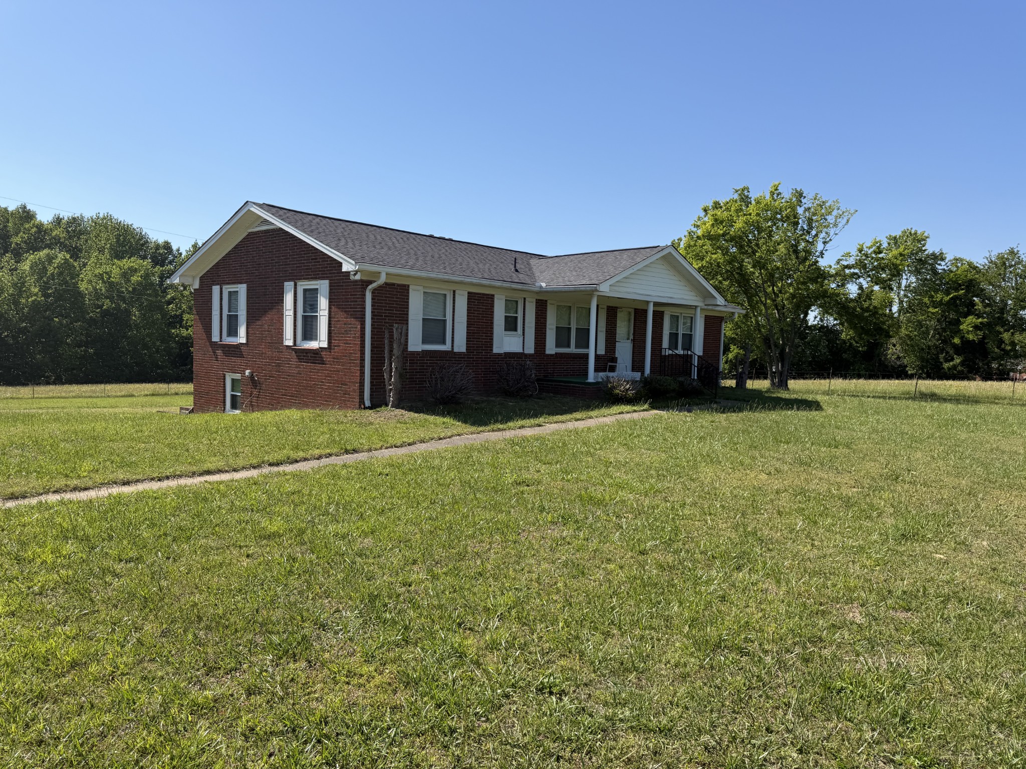 2276 South Mt Pleasant Road Greenbrier, TN 37073 - Photo 1 of 20 a front view of a house with a yard