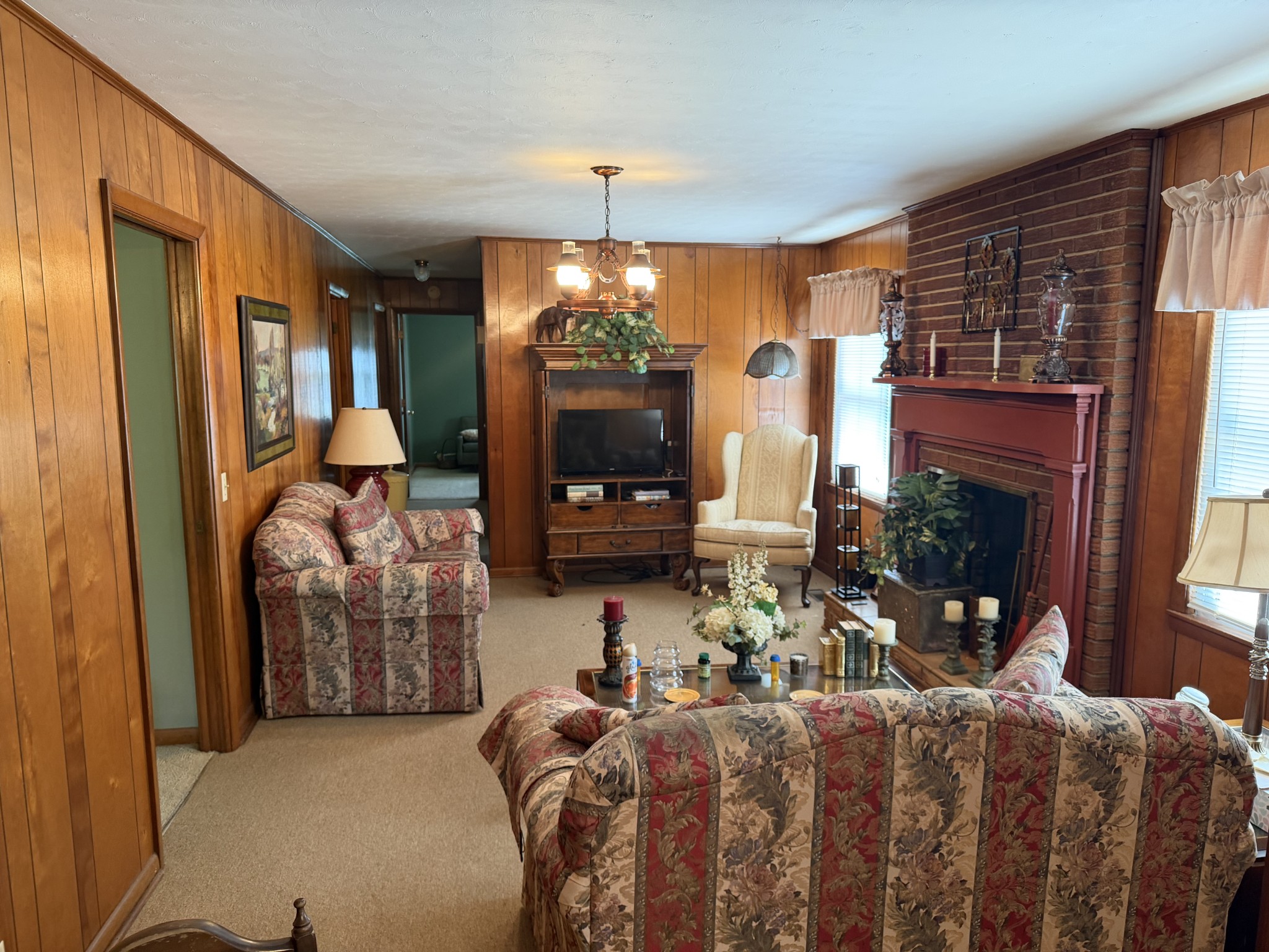 2276 South Mt Pleasant Road Greenbrier, TN 37073 - Photo 18 of 20 a living room with furniture a flat screen tv and a fireplace