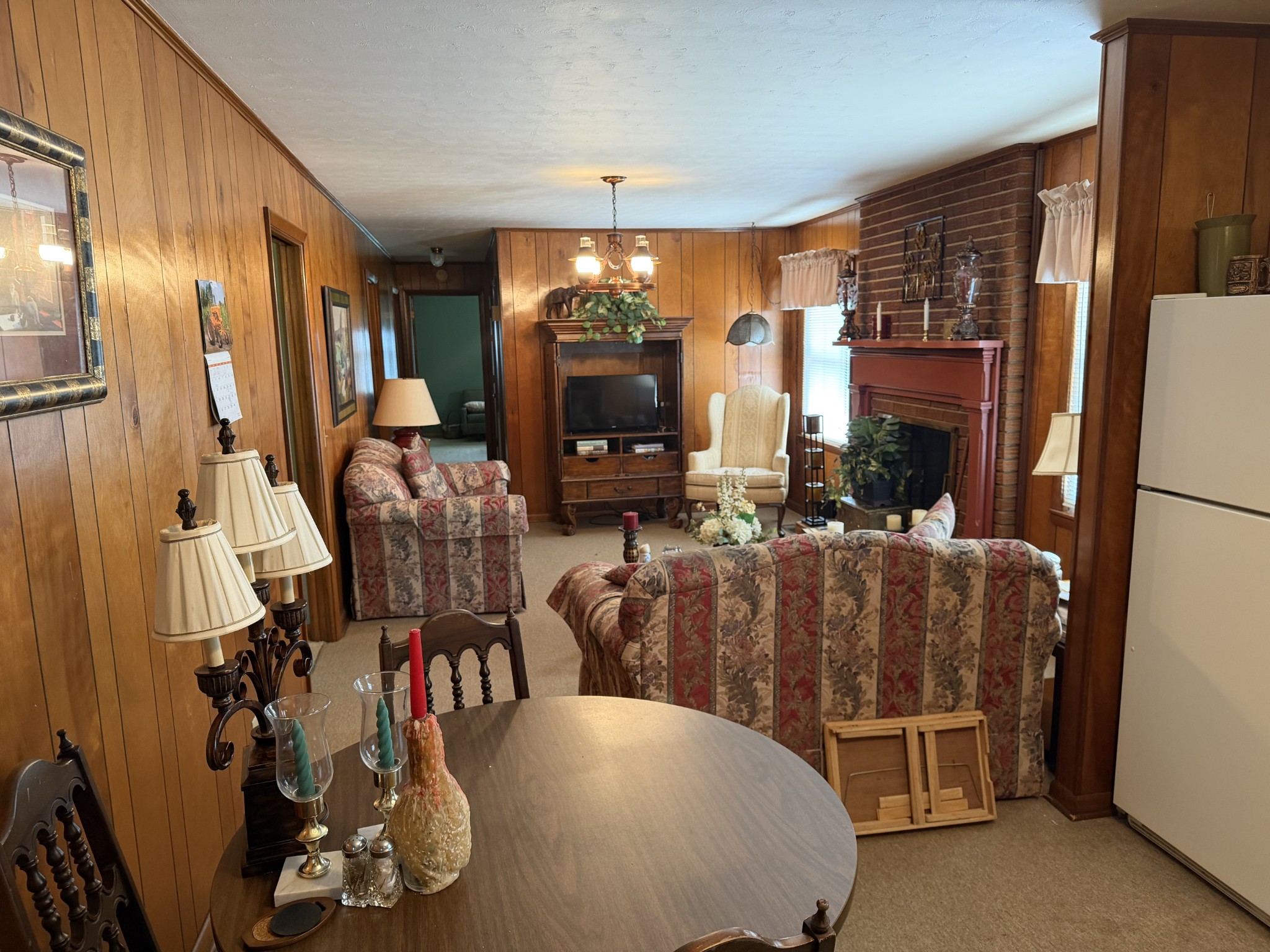 2276 South Mt Pleasant Road Greenbrier, TN 37073 - Photo 6 of 20 a living room with furniture a flat screen tv and floor to ceiling window