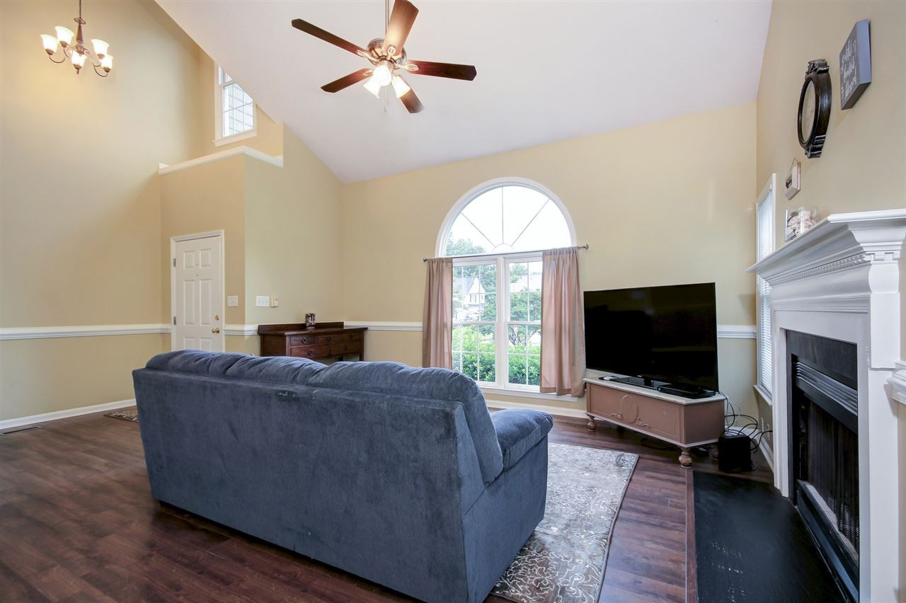 5300 Halcott Court Raleigh, NC 27613 - Photo 5 of 23 Vaulted ceilings enhance the space and living room is open to the dining room so wonderful for entertaining. Living Room