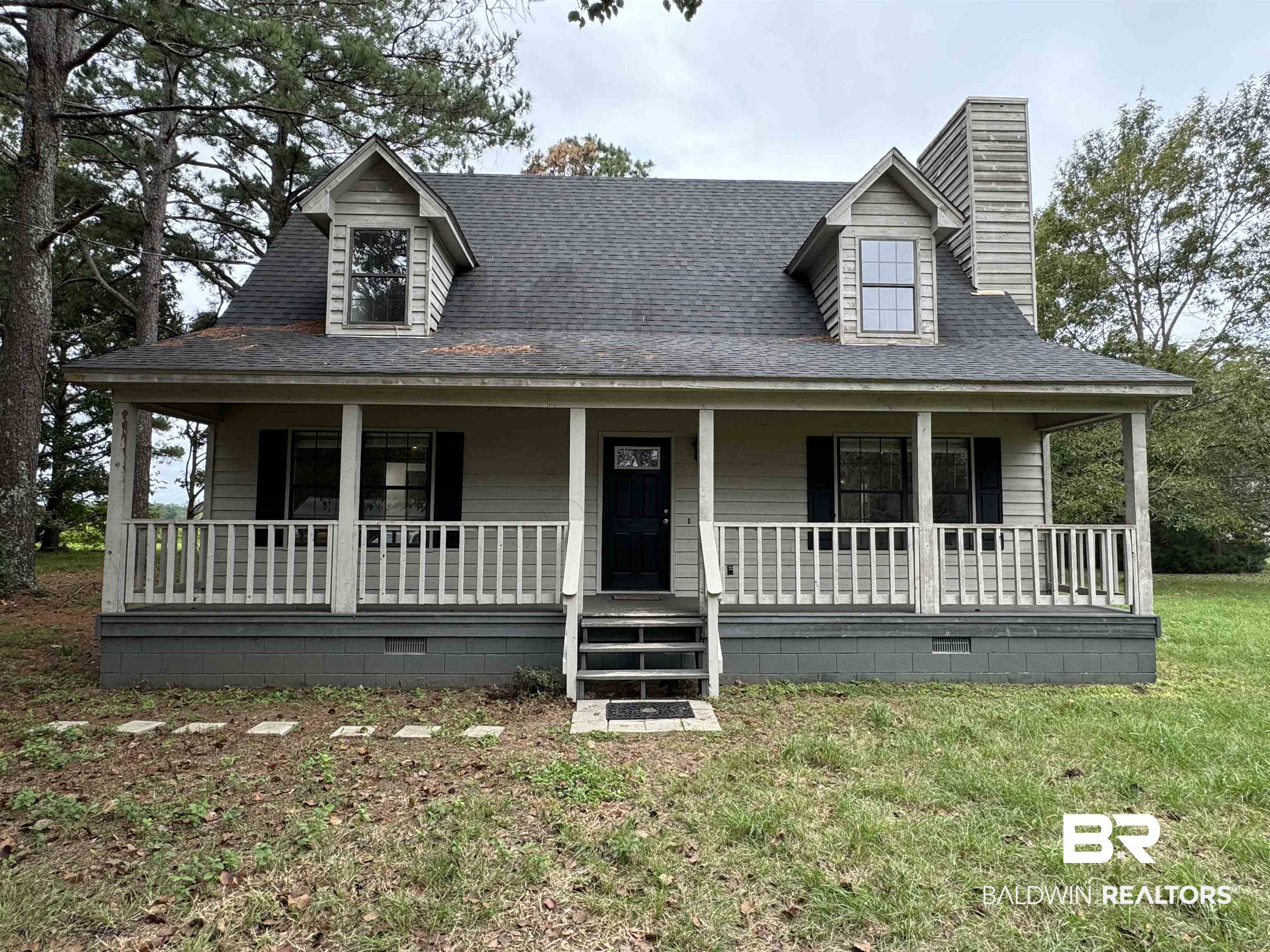 70 Plum Street Uriah, AL 36480 - Photo 30 of 36 View of front of home featuring covered porch and a front yard
