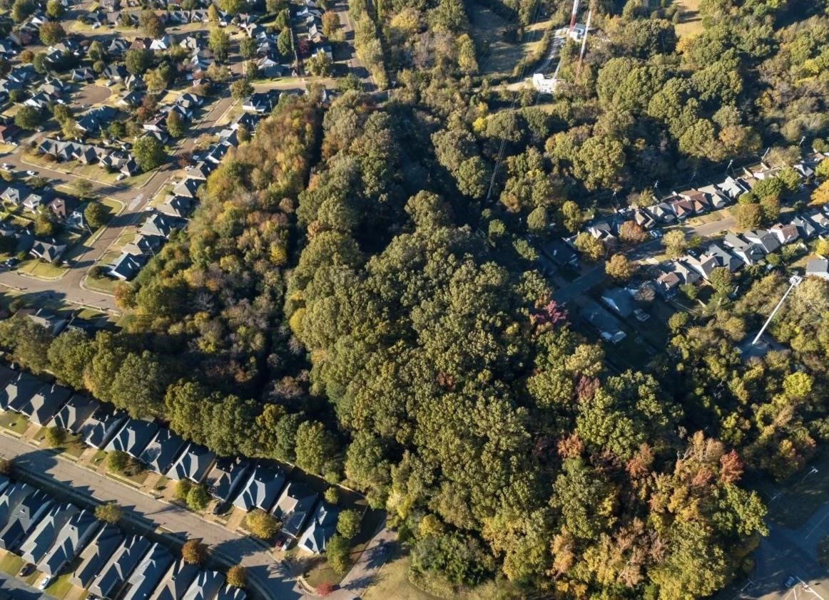 7273 Raleigh Lagrange Road Cordova, TN 38018 - Photo 25 of 30 Aerial view of property and surrounding area featuring nearby suburban area and a heavily wooded area