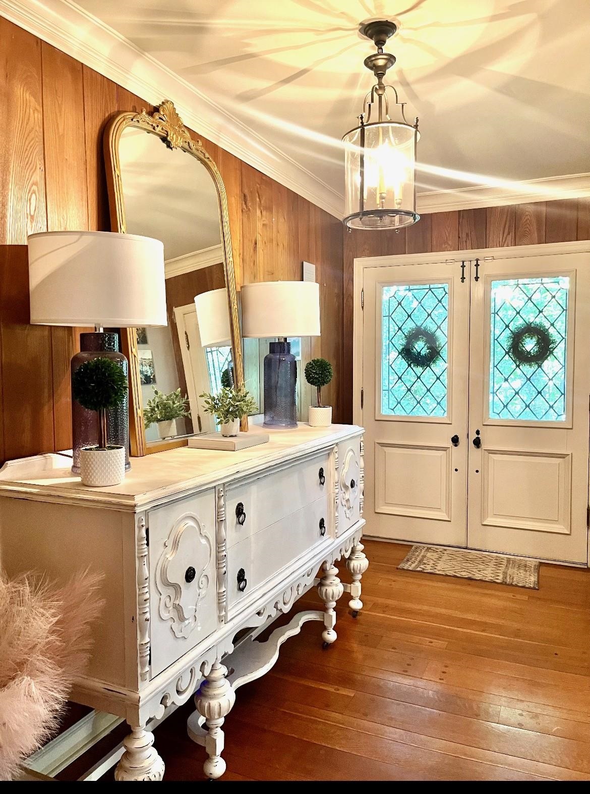 7273 Raleigh Lagrange Road Cordova, TN 38018 - Photo 5 of 30 Foyer featuring ornamental molding, hardwood / wood-style flooring, healthy amount of natural light, wooden walls, and french doors