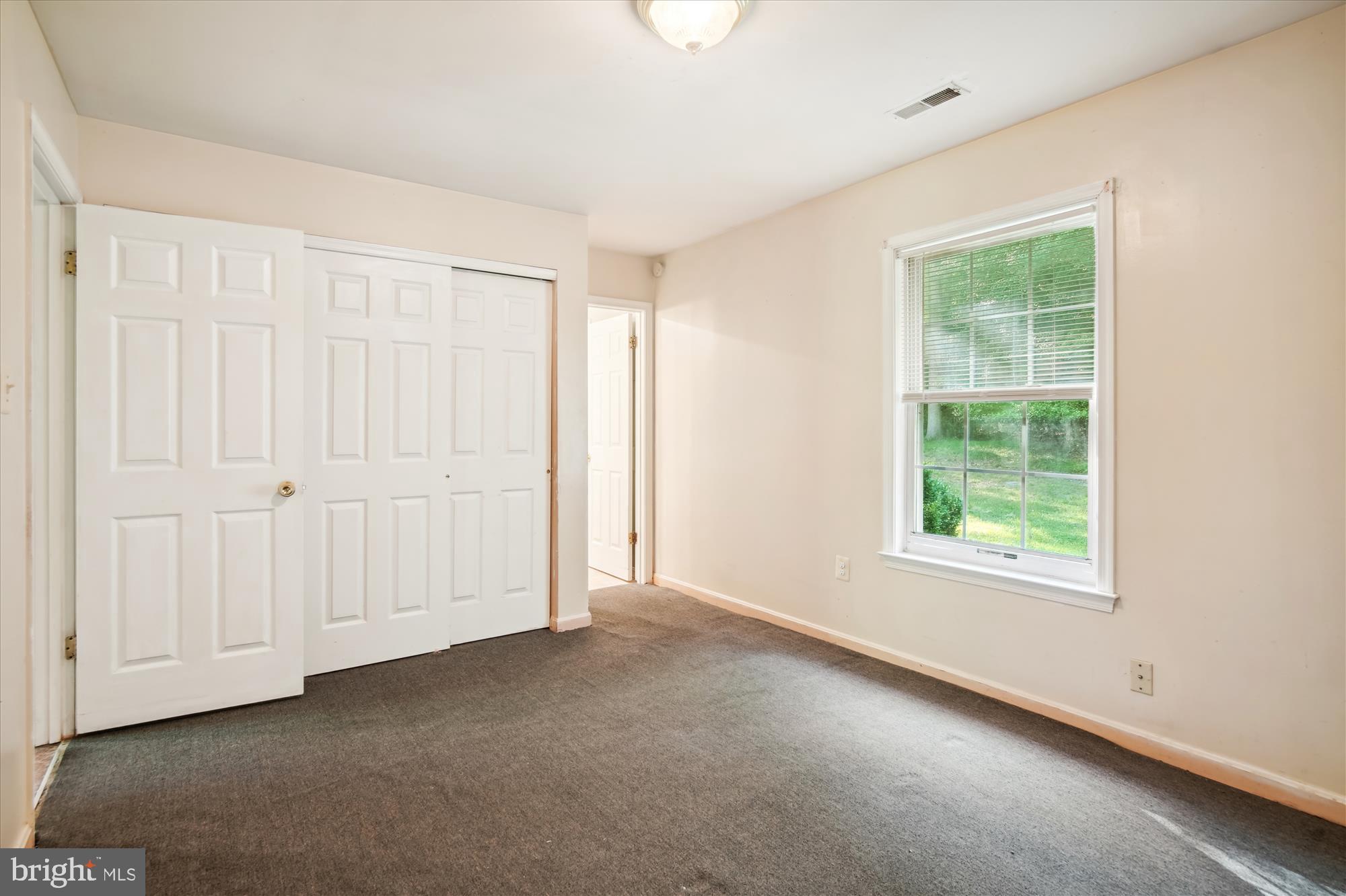 14050 Oaks Road Hughesville, MD 20637 - Photo 17 of 22 an empty room with a window