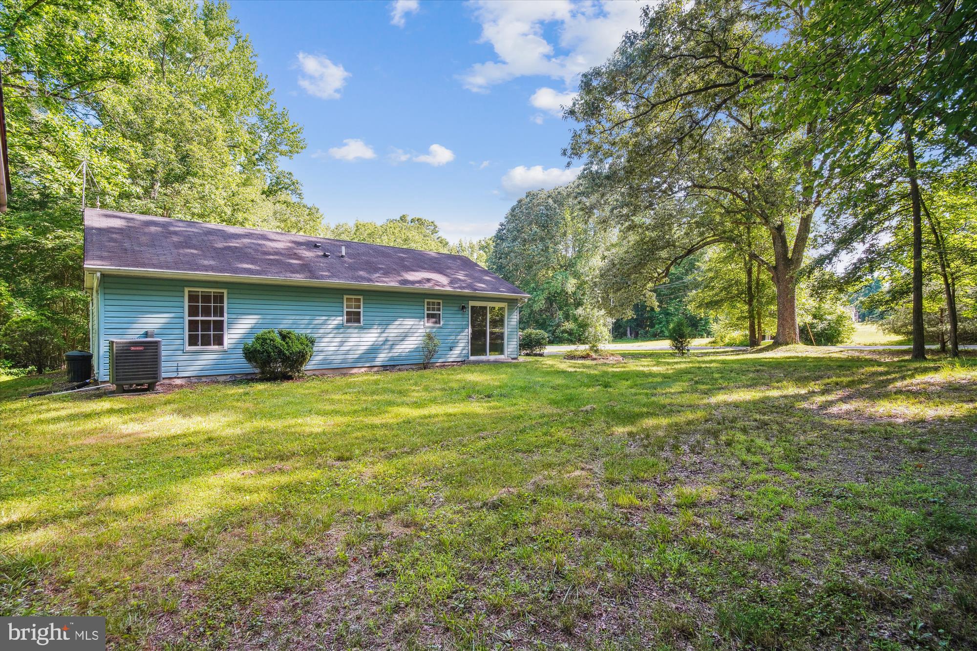 14050 Oaks Road Hughesville, MD 20637 - Photo 20 of 22 a front view of a house with a garden