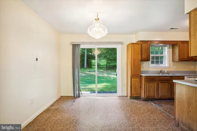 a view of a kitchen with granite countertop cabinets and window