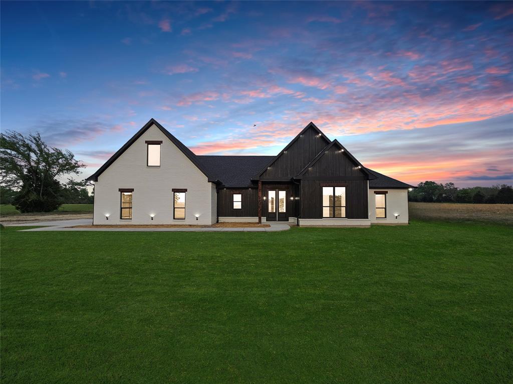 a view of a house with a big yard