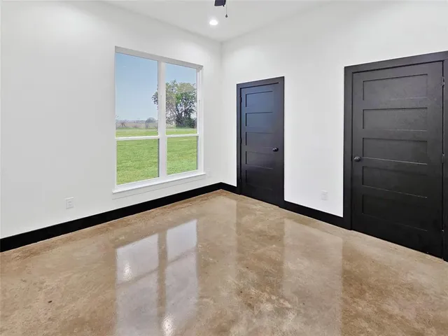 an empty room with windows