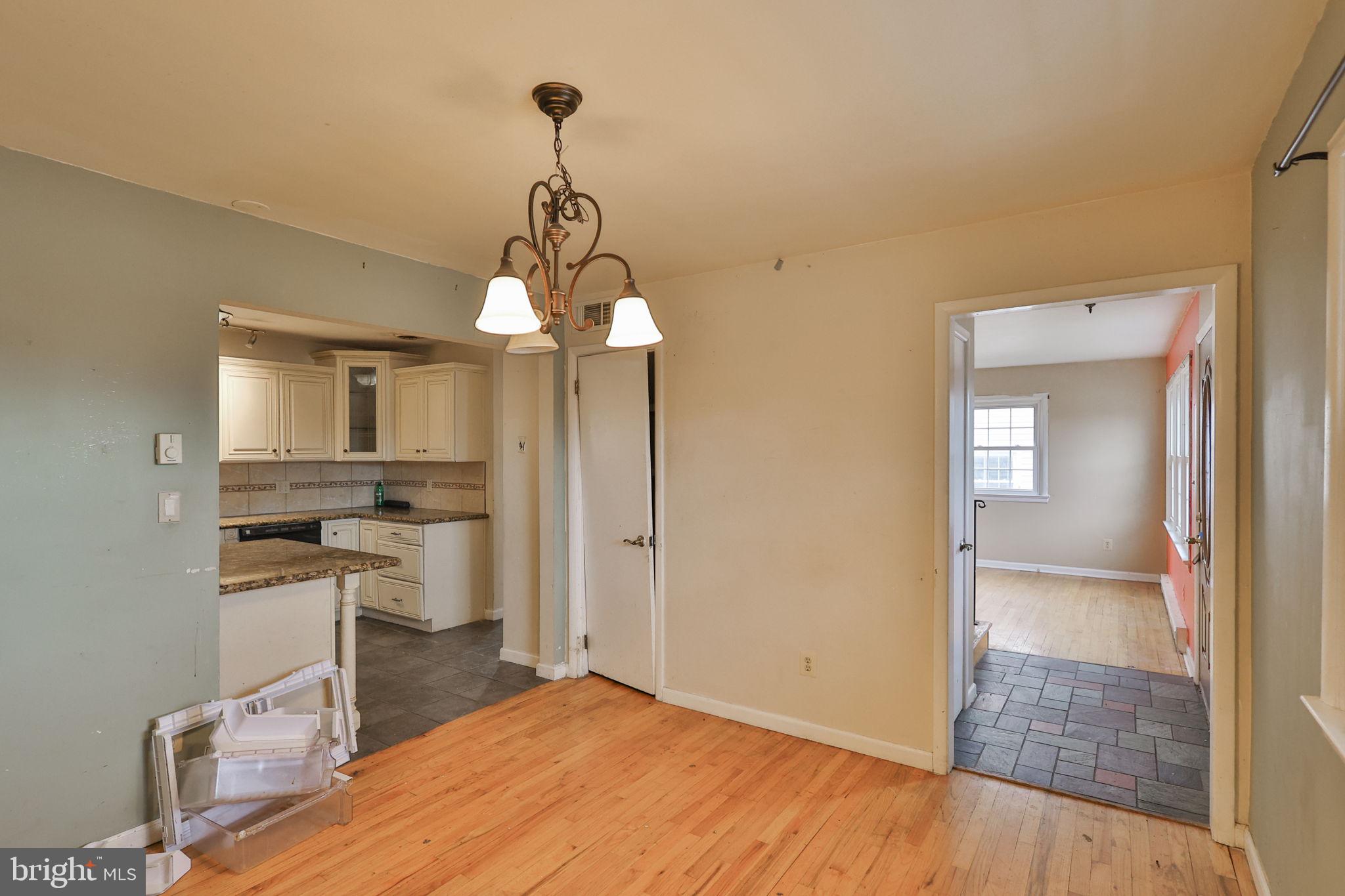 210 South 16th Street Emmaus, PA 18049 - Photo 13 of 92 a view of a room with wooden floor electronic appliances and kitchen view