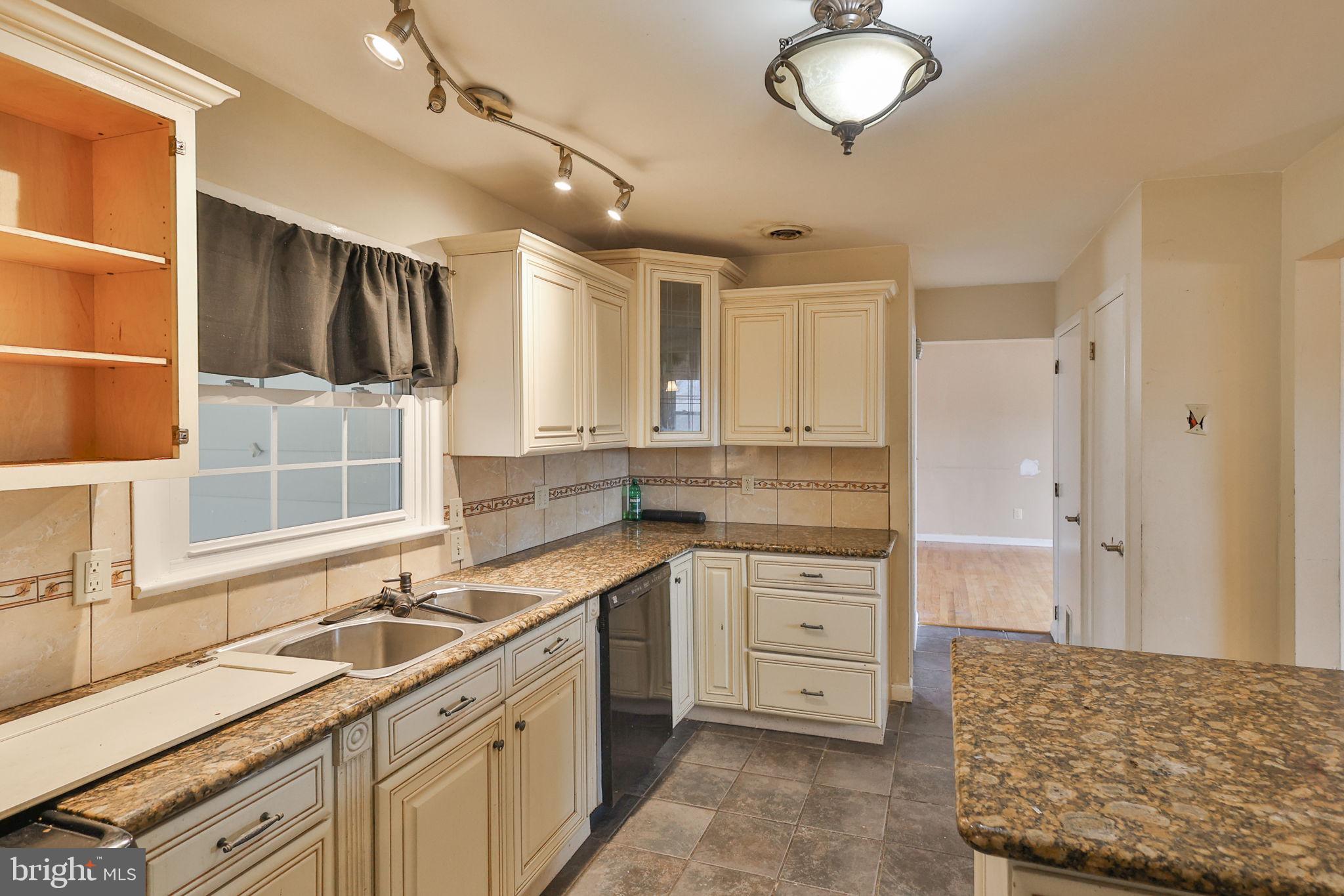210 South 16th Street Emmaus, PA 18049 - Photo 23 of 92 a kitchen with a sink stove and cabinets