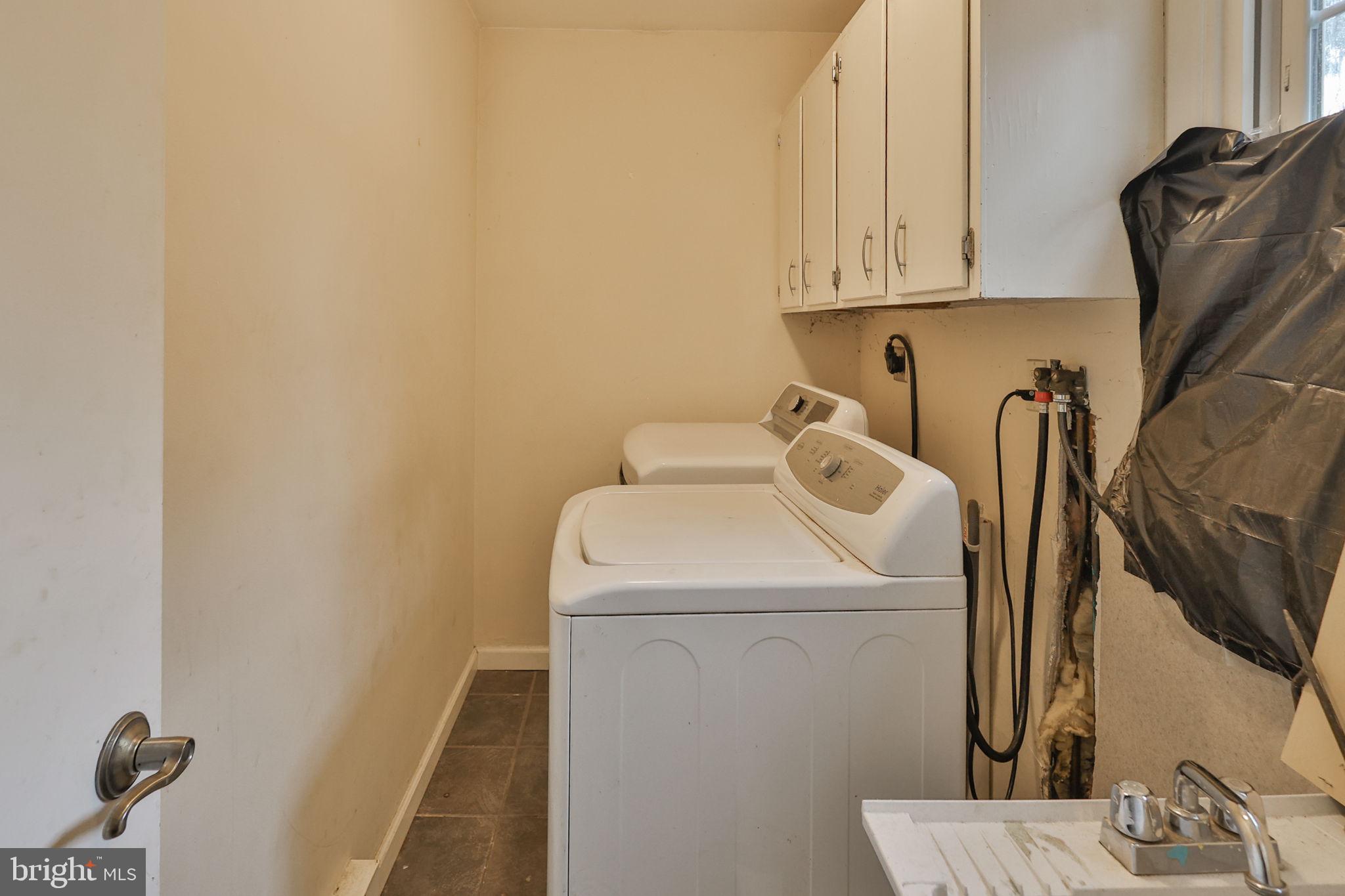 210 South 16th Street Emmaus, PA 18049 - Photo 25 of 92 a view of storage and utility room with washer and dryer