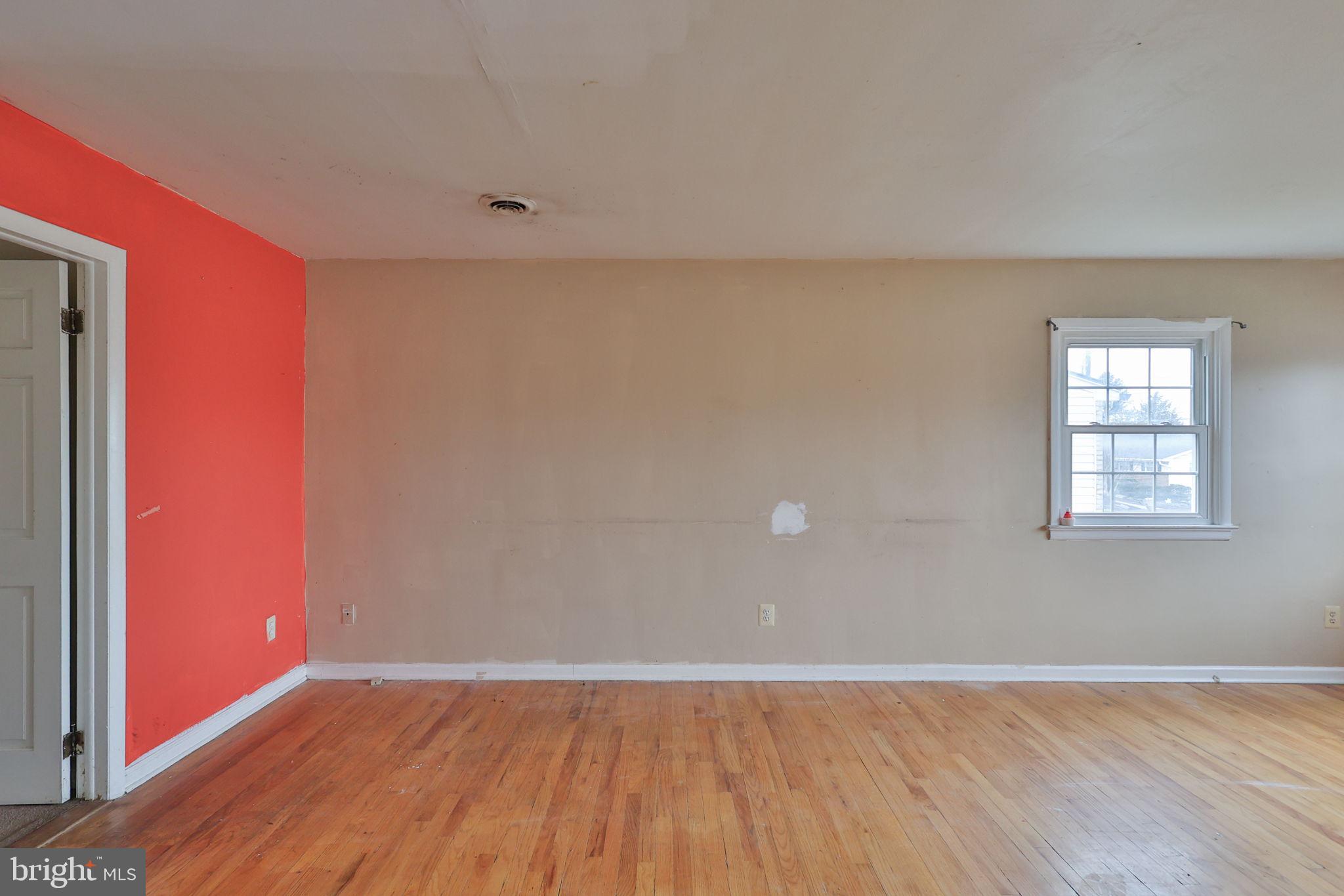 210 South 16th Street Emmaus, PA 18049 - Photo 28 of 92 an empty room with wooden floor and windows