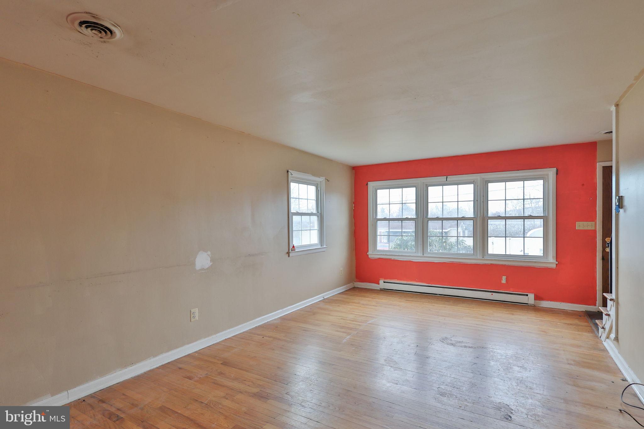 210 South 16th Street Emmaus, PA 18049 - Photo 29 of 92 a view of empty room with wooden floor and fan