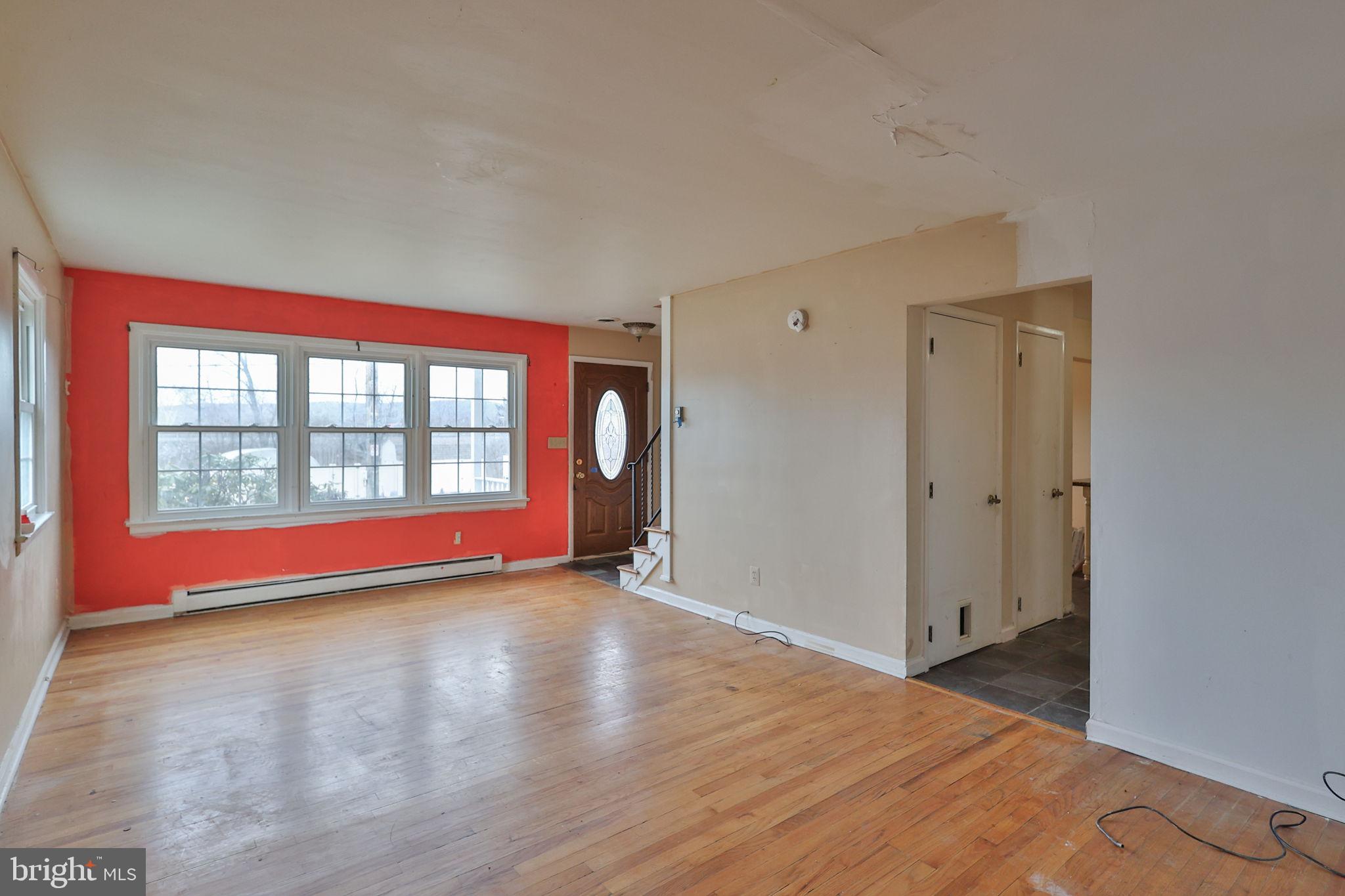 210 South 16th Street Emmaus, PA 18049 - Photo 31 of 92 a view of empty room with wooden floor and fan