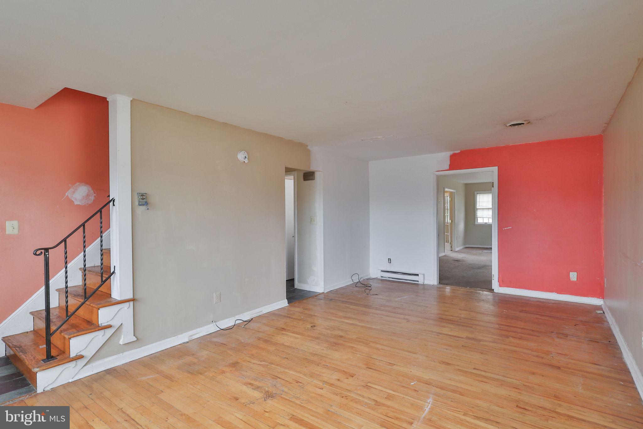 210 South 16th Street Emmaus, PA 18049 - Photo 32 of 92 a view of an empty room with wooden floor and a window