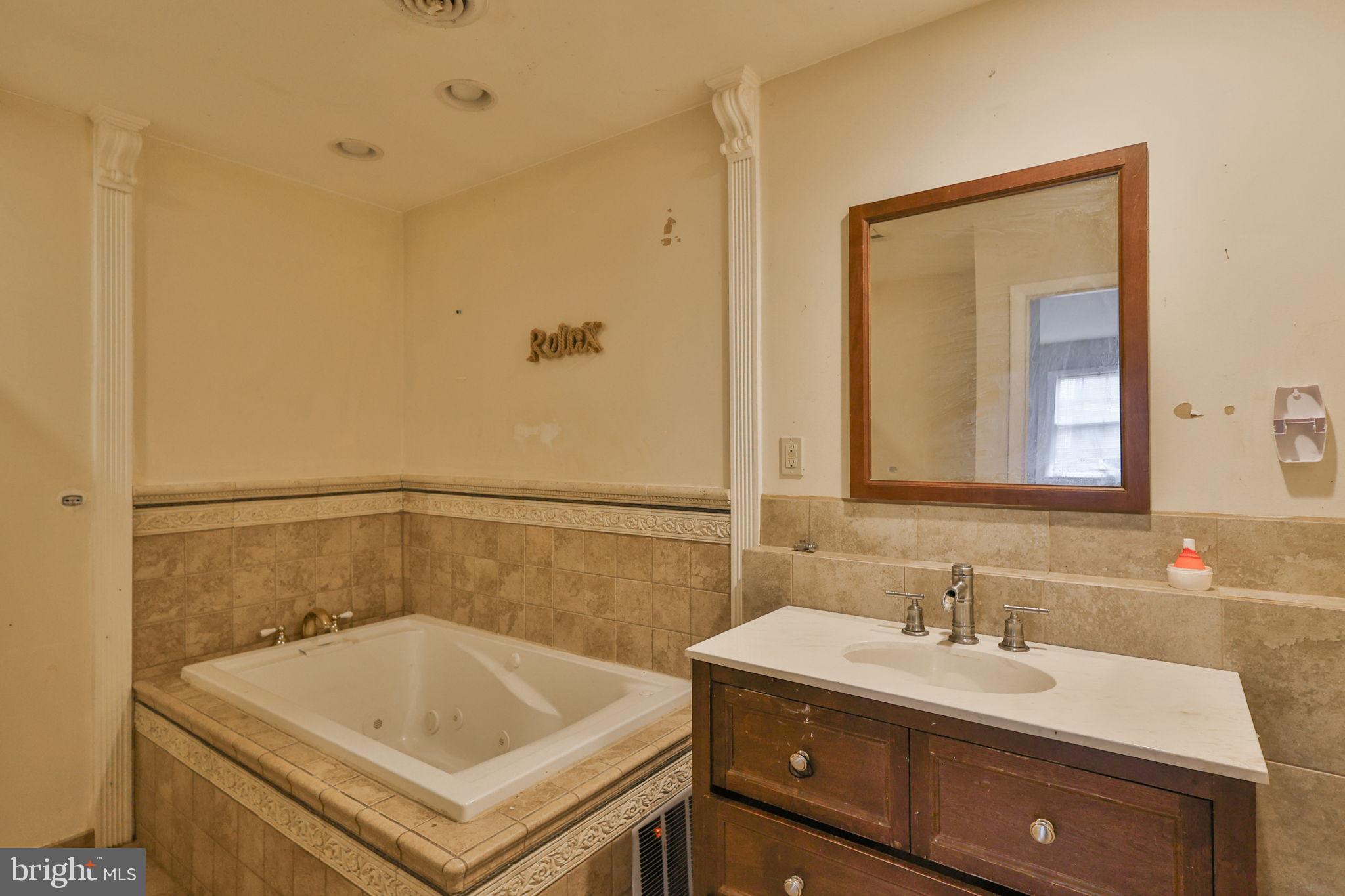 210 South 16th Street Emmaus, PA 18049 - Photo 47 of 92 a bathroom with a sink and a mirror