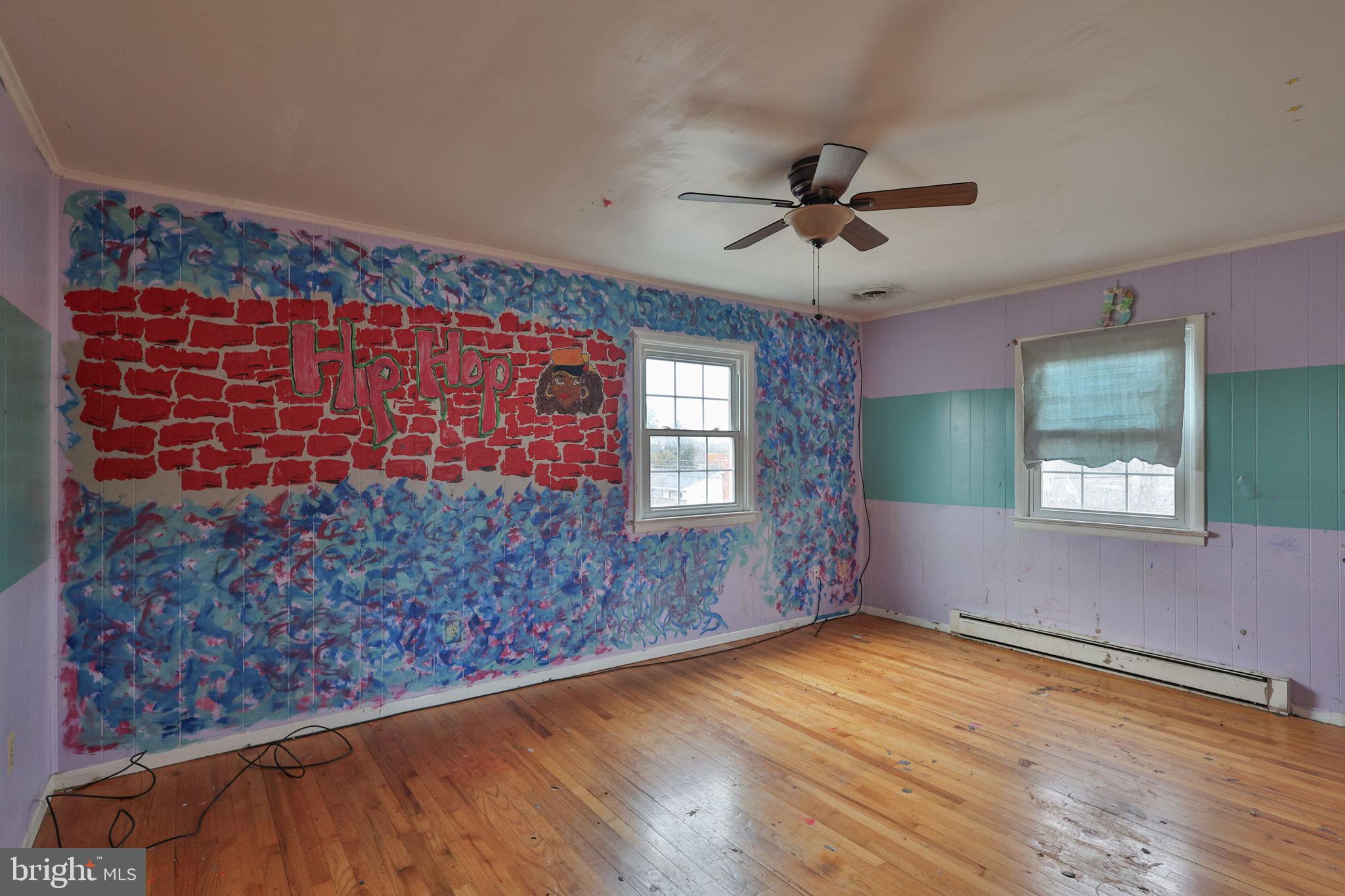 210 South 16th Street Emmaus, PA 18049 - Photo 50 of 92 a view of empty room with window and wooden floor