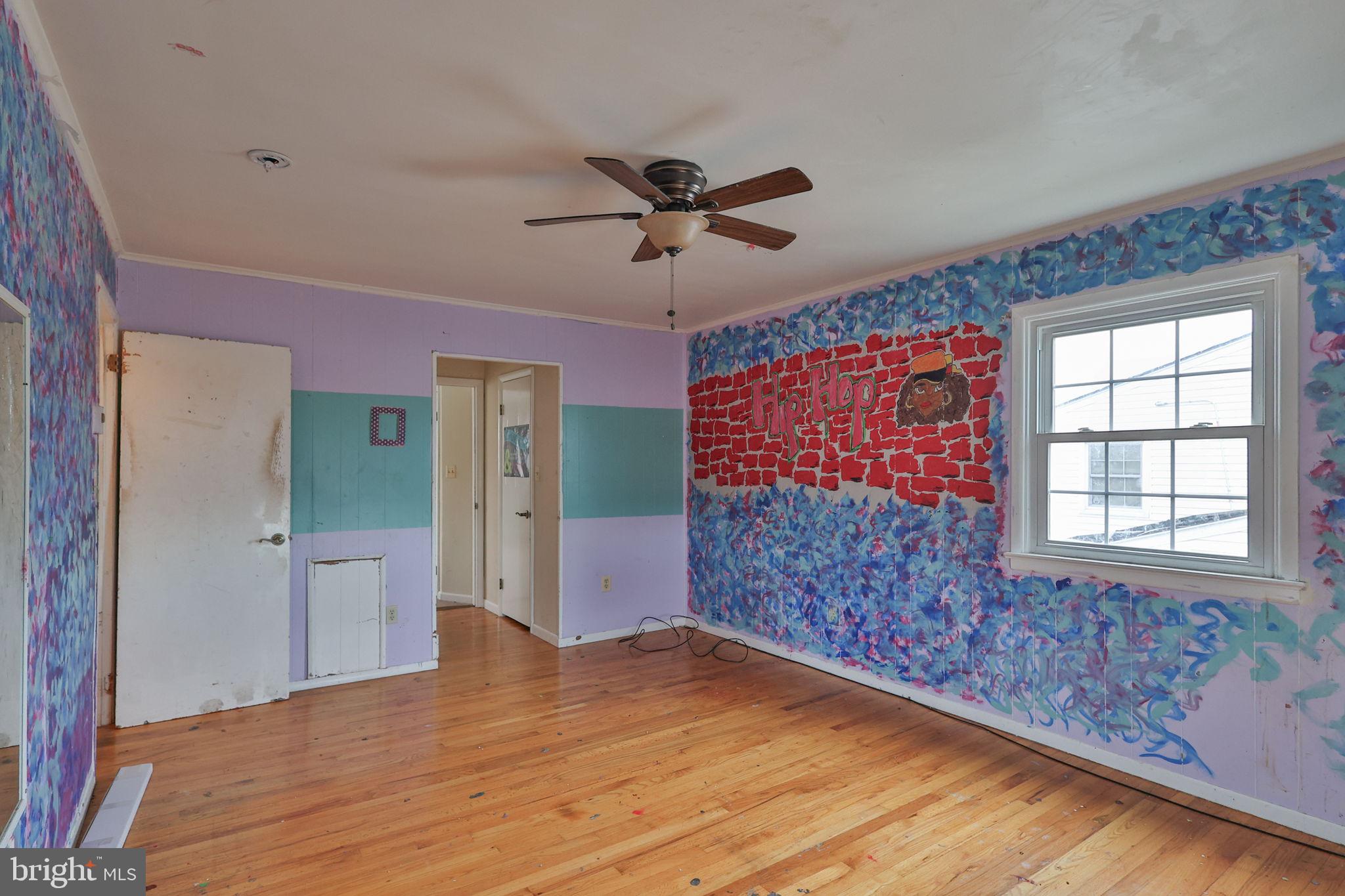210 South 16th Street Emmaus, PA 18049 - Photo 52 of 92 a view of empty room with a ceiling fan and wooden floor