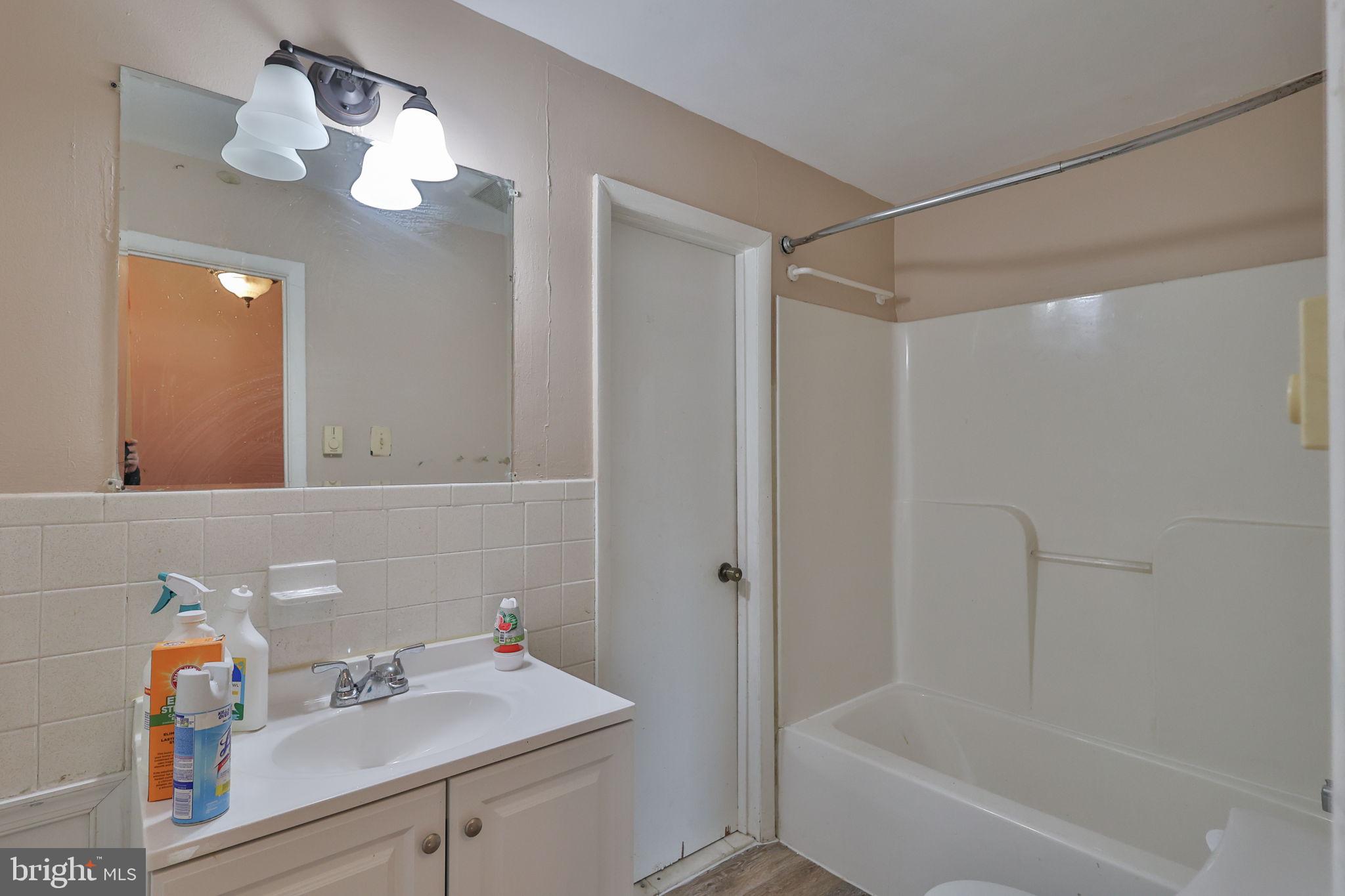 210 South 16th Street Emmaus, PA 18049 - Photo 60 of 92 a bathroom with a sink vanity mirror and shower