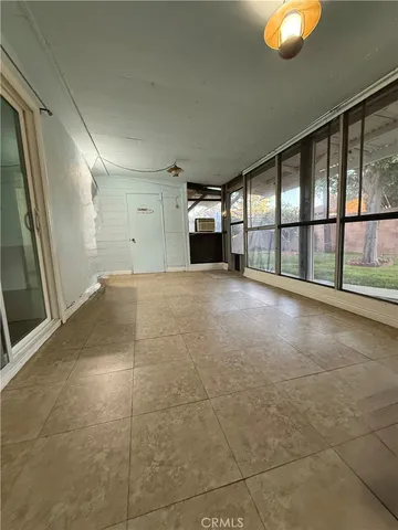 a view of a hallway with an empty room