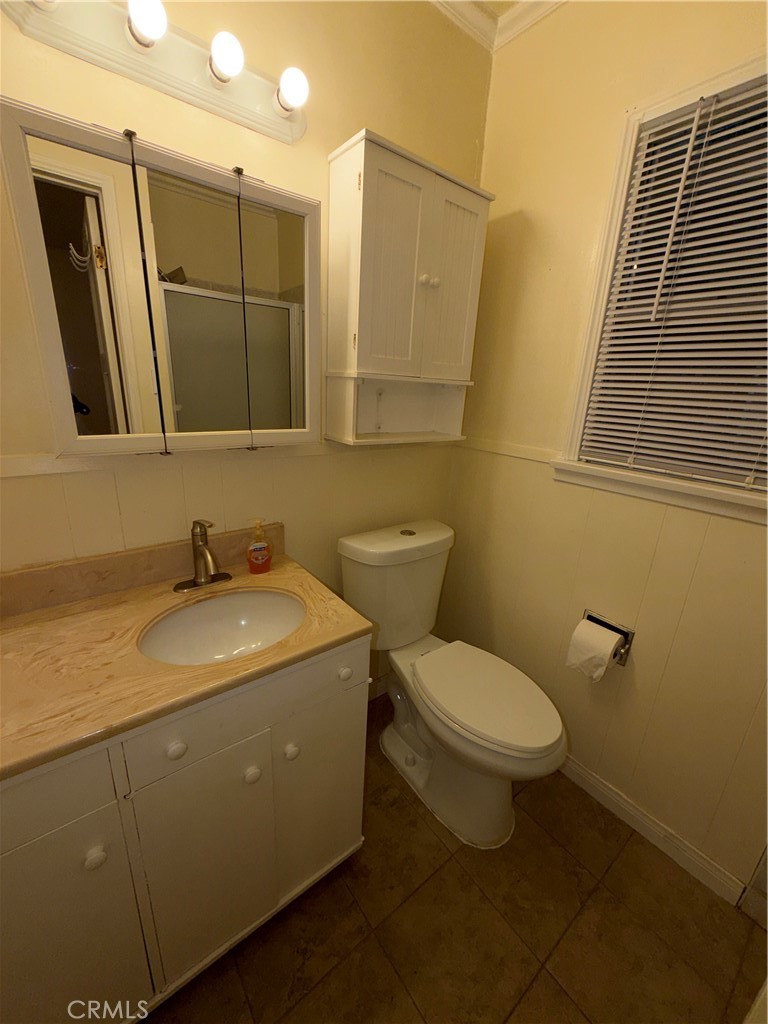 7012 Forbes Avenue Van Nuys, CA 91406 - Photo 3 of 9 a bathroom with a sink and a toilet