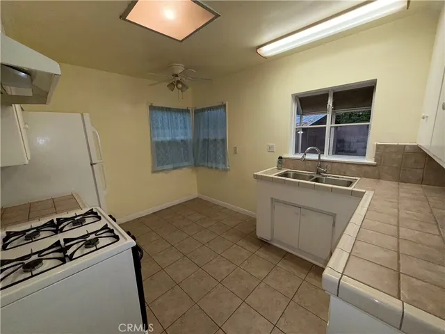 a kitchen with a stove and a sink