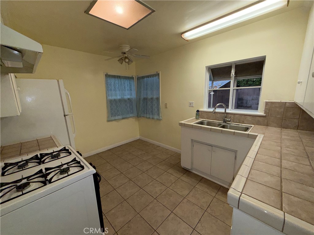 7012 Forbes Avenue Van Nuys, CA 91406 - Photo 9 of 9 a kitchen with a stove and a sink