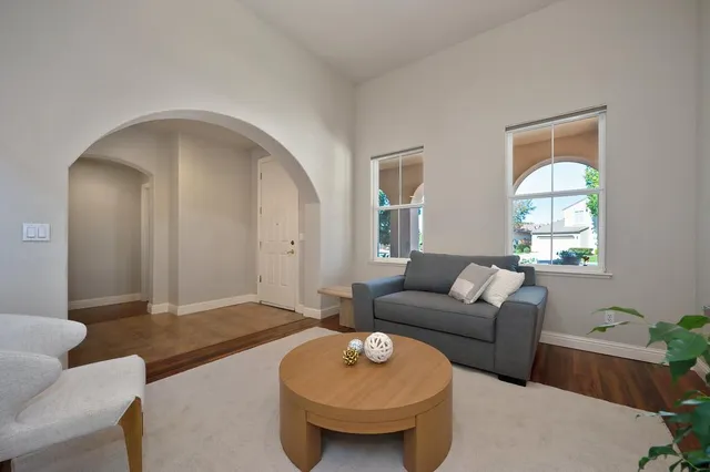 a view of a dining room with furniture and window