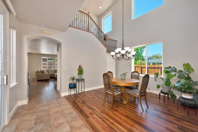 a kitchen with a refrigerator and a stove top oven