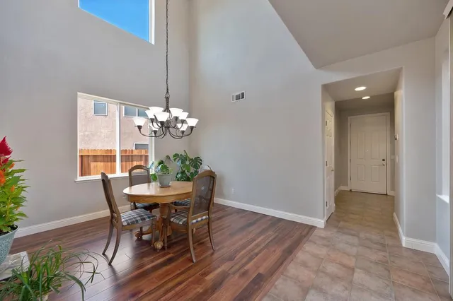 a kitchen with sink refrigerator and microwave