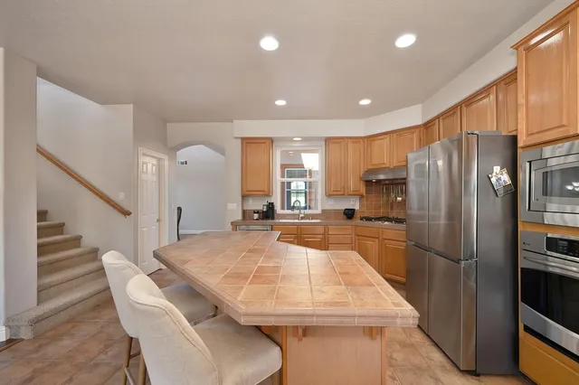 a living room with furniture fireplace and window