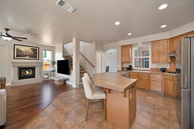 a living room with couches and a large window