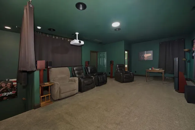 a bedroom with a large bed and a flat screen tv