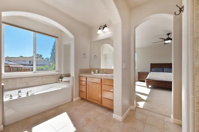 a view of a hallway with closet and stairs