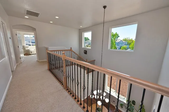 a bathroom with a sink a toilet a mirror and shower
