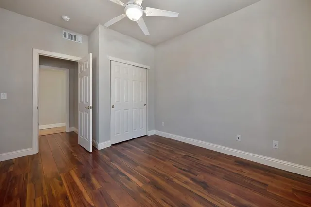 a view of a patio with a table and chairs