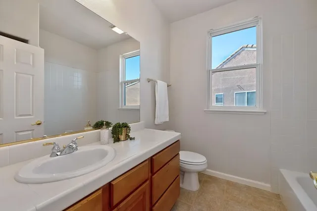 a view of backyard with outdoor and green space