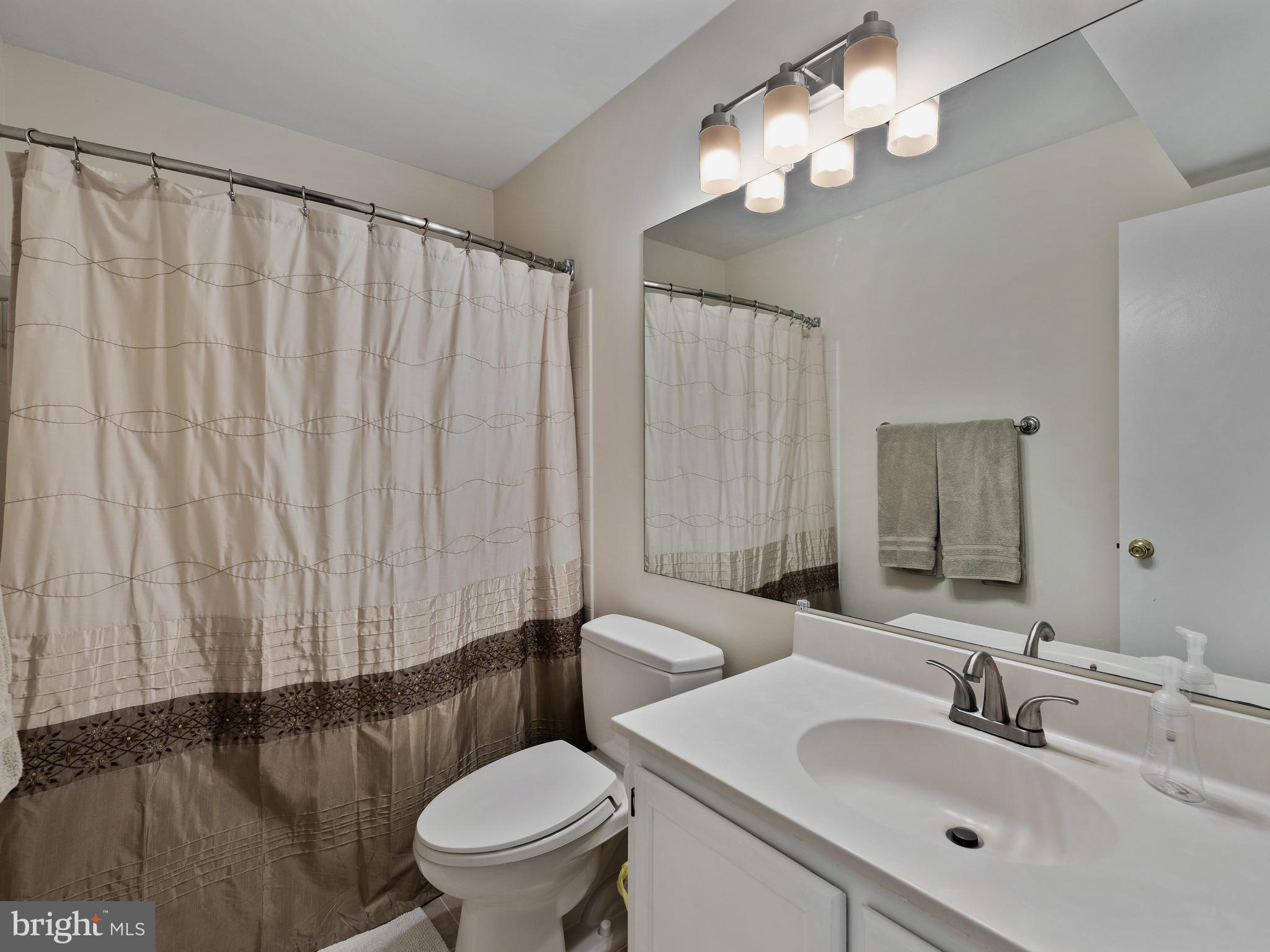 14905 McKisson Court, Unit E Silver Spring, MD 20906 - Photo 20 of 32 First full bathroom, with ample counter space