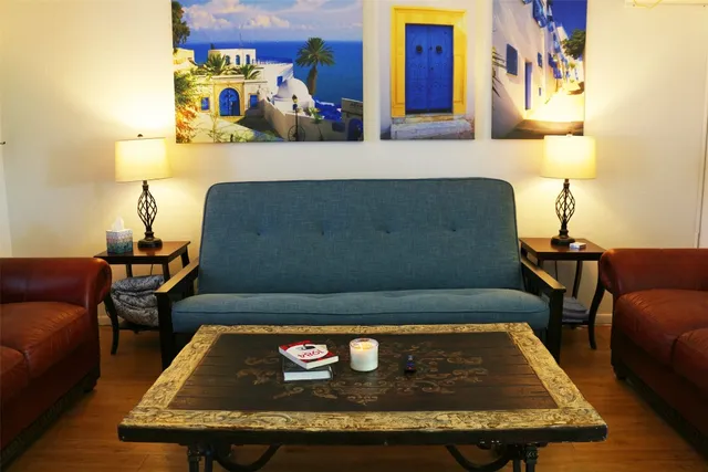 a living room with table and a couch