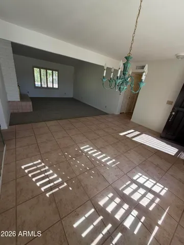 a view of an empty room with windows