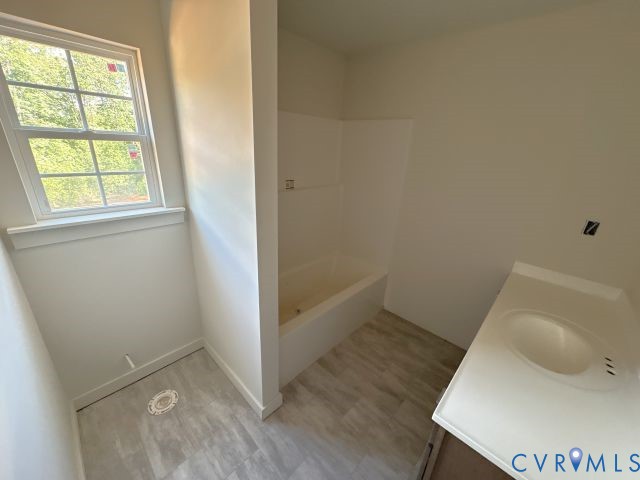 2570 Doctors Road Louisa, VA 23093 - Photo 14 of 14 an empty room with wooden floor and windows