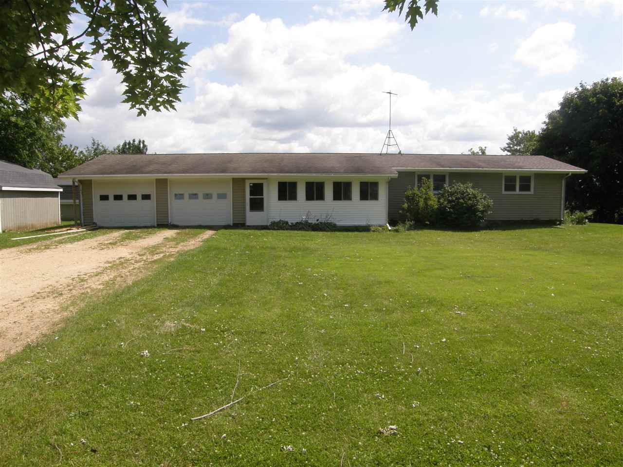 16700 Goodrich Road Durand, IL 61024 - Photo 1 of 18 a front view of a house with garden