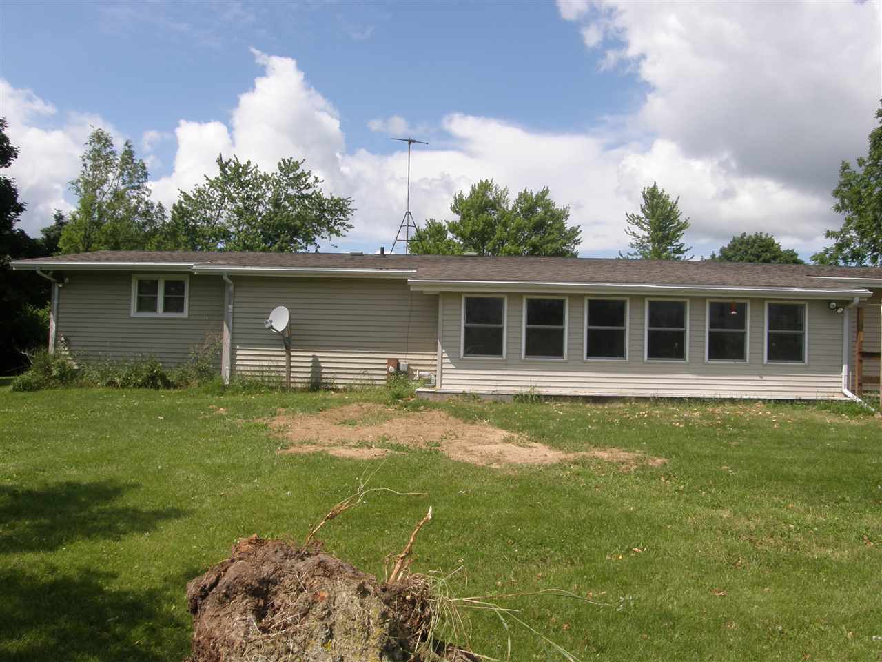 16700 Goodrich Road Durand, IL 61024 - Photo 3 of 18 a backyard of a house with table and chairs